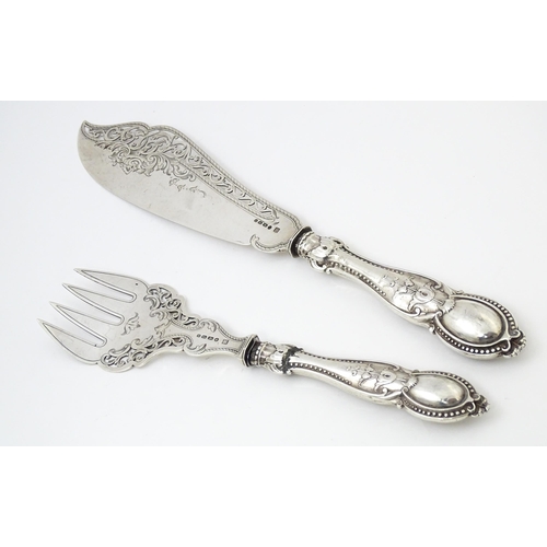 390 - A pair of Victorian silver fish servers hallmarked Birmingham 1865, maker Thomas Prime & Son. Larges... 