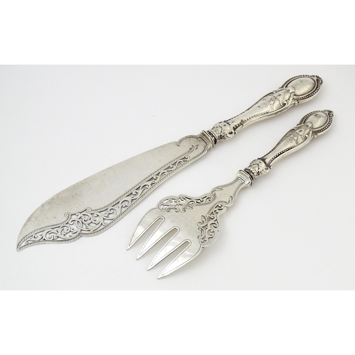 390 - A pair of Victorian silver fish servers hallmarked Birmingham 1865, maker Thomas Prime & Son. Larges... 