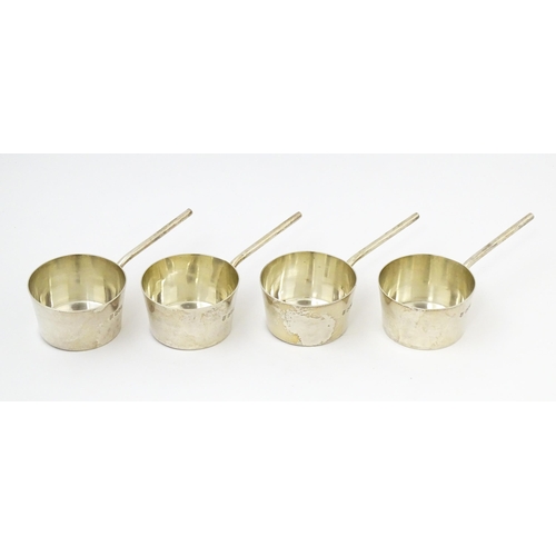 394 - A set of four silver brandy /spirit warming saucepans, hallmarked London 1904, maker Josiah Williams... 