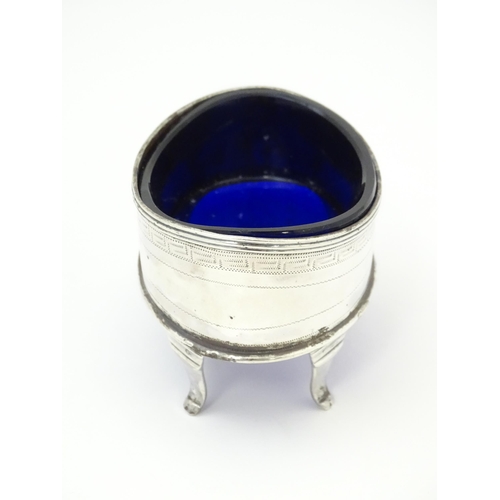 399 - An early 19thC Newcastle silver salt of oval form with blue liner. Approx. 3 1/4