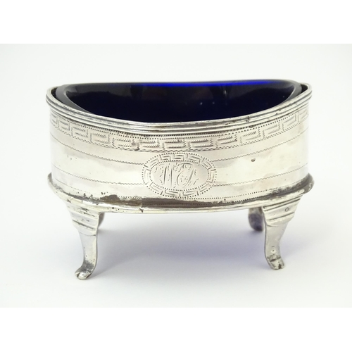 399 - An early 19thC Newcastle silver salt of oval form with blue liner. Approx. 3 1/4