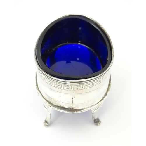 399 - An early 19thC Newcastle silver salt of oval form with blue liner. Approx. 3 1/4