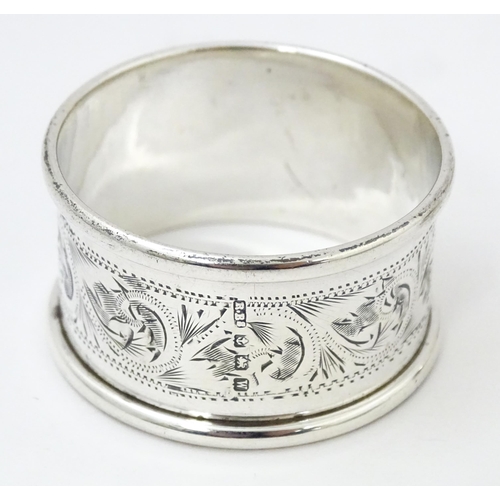 400 - Three assorted silver napkin rings with engraved decoration hallmarked Birmingham 1895, 1921 and 198... 