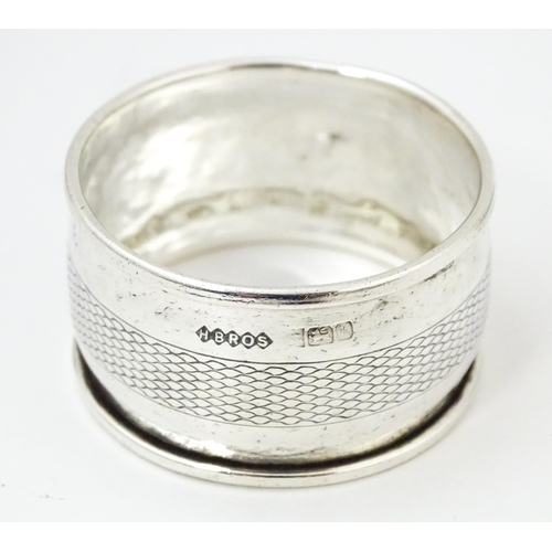 400 - Three assorted silver napkin rings with engraved decoration hallmarked Birmingham 1895, 1921 and 198... 