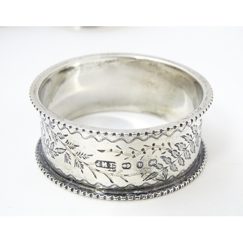 400 - Three assorted silver napkin rings with engraved decoration hallmarked Birmingham 1895, 1921 and 198... 