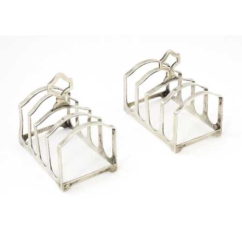 401 - A pair of silver four bar toast racks hallmarked Birmingham 1936, maker Adie Brothers Ltd. Approx. 3... 