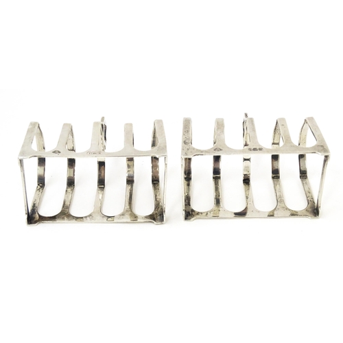 401 - A pair of silver four bar toast racks hallmarked Birmingham 1936, maker Adie Brothers Ltd. Approx. 3... 