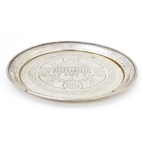 402 - A 19thC Russian silver dish with engraved decoration depicting a building with spires and flag. Appr... 