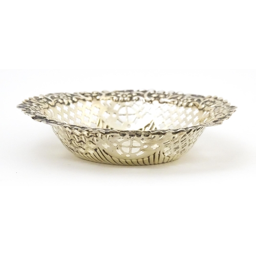 403 - A Victorian silver bon bon dish with embossed and pierced decoration, hallmarked Birmingham 1897, ma... 