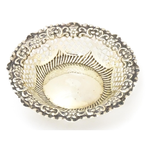 403 - A Victorian silver bon bon dish with embossed and pierced decoration, hallmarked Birmingham 1897, ma... 