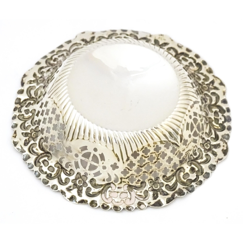 403 - A Victorian silver bon bon dish with embossed and pierced decoration, hallmarked Birmingham 1897, ma... 