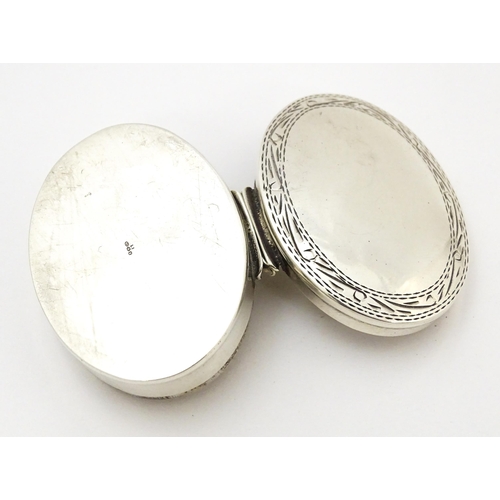 405 - A .925 silver pill box of oval form. Approx. 1 1/2