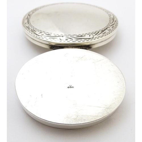 405 - A .925 silver pill box of oval form. Approx. 1 1/2