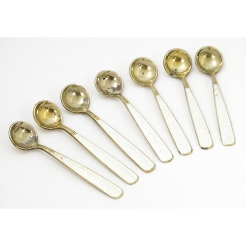 407 - Scandinavian silver: A large set of Danish silver gilt salts, spoons and pepperettes with guilloche ... 