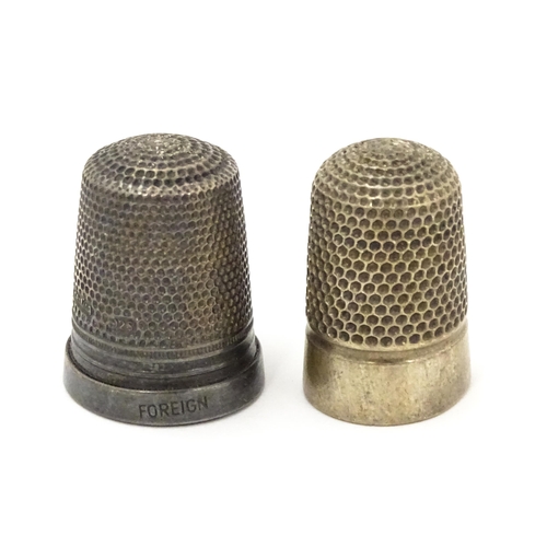 417 - A silver thimble hallmarked Chester 1921. Together with a silver plate example bearing crest for Ply... 