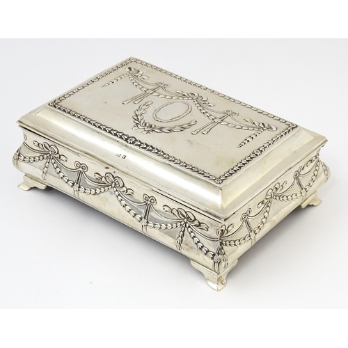 418 - A silver jewellery box with swag and bow detail, opening to reveal a silk lined interior, hallmarked... 