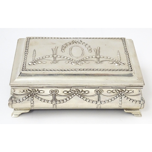 418 - A silver jewellery box with swag and bow detail, opening to reveal a silk lined interior, hallmarked... 