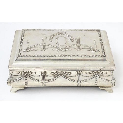 418 - A silver jewellery box with swag and bow detail, opening to reveal a silk lined interior, hallmarked... 