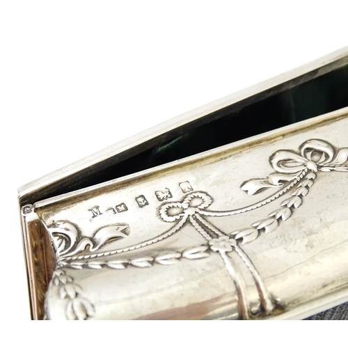 418 - A silver jewellery box with swag and bow detail, opening to reveal a silk lined interior, hallmarked... 