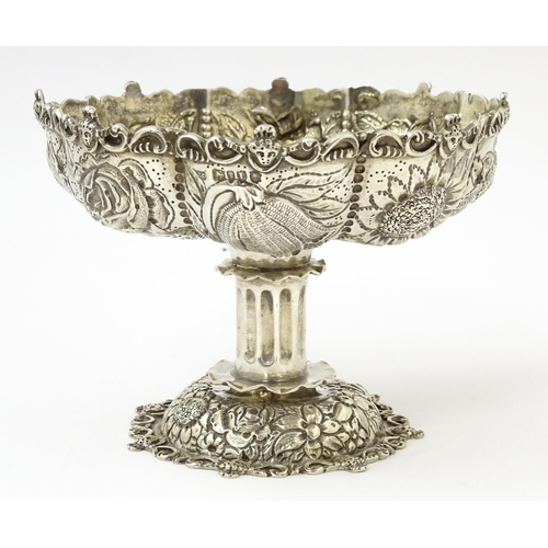 440 - A Victorian comport / tazza with embossed floral decoration, hallmarked London 1886, maker William C... 