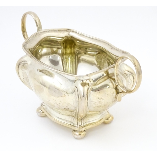 443 - A silver twin handled sugar bowl hallmarked Sheffield 1908, maker Joseph Rogers & Sons. Approx. 4 1/... 