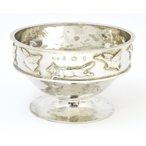 446 - Albert Edward Jones : An Arts & Crafts silver hammered pedestal bowl with banded relief decoration d... 