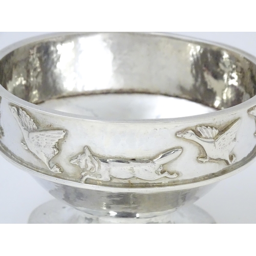 446 - Albert Edward Jones : An Arts & Crafts silver hammered pedestal bowl with banded relief decoration d... 