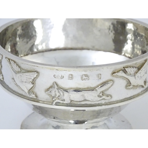 446 - Albert Edward Jones : An Arts & Crafts silver hammered pedestal bowl with banded relief decoration d... 