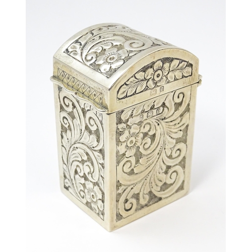 448 - A silver playing card box with embossed floral and foliate decoration and gilded interior, hallmarke... 