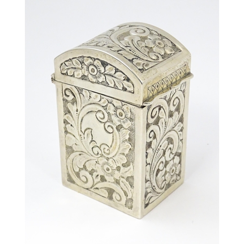 448 - A silver playing card box with embossed floral and foliate decoration and gilded interior, hallmarke... 