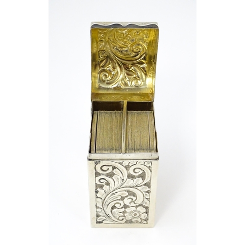 448 - A silver playing card box with embossed floral and foliate decoration and gilded interior, hallmarke... 