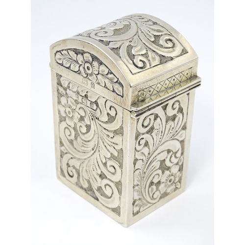 448 - A silver playing card box with embossed floral and foliate decoration and gilded interior, hallmarke... 