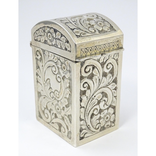 448 - A silver playing card box with embossed floral and foliate decoration and gilded interior, hallmarke... 