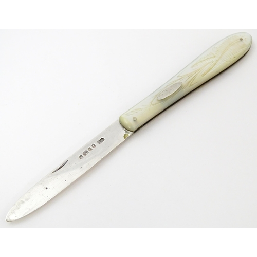 450 - A Victorian silver folding fruit knife with mother of pearl handle with engraved fern and foliate de... 