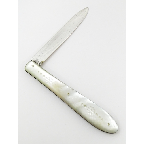 450 - A Victorian silver folding fruit knife with mother of pearl handle with engraved fern and foliate de... 