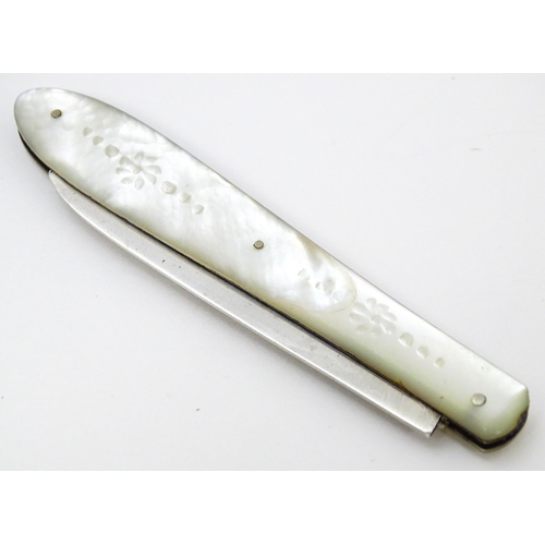 450 - A Victorian silver folding fruit knife with mother of pearl handle with engraved fern and foliate de... 