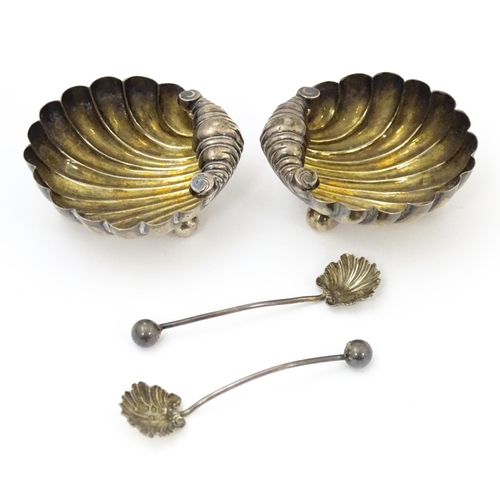 451 - A pair of Victorian silver salts and salt spoons of shell form, hallmarked Birmingham 1893, maker CB... 