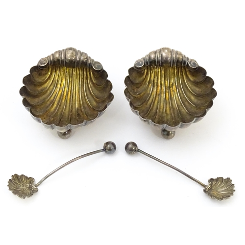 451 - A pair of Victorian silver salts and salt spoons of shell form, hallmarked Birmingham 1893, maker CB... 