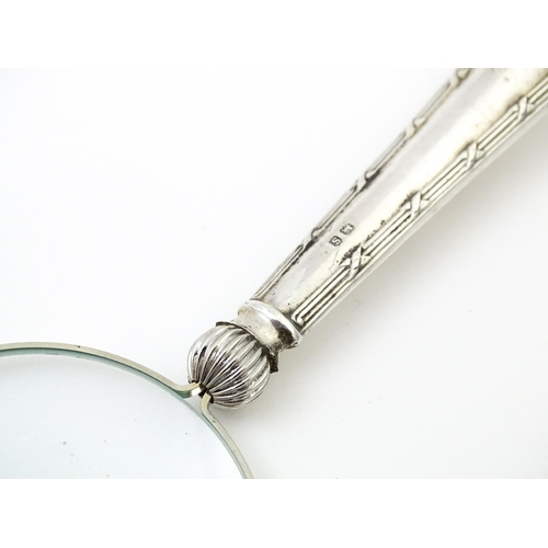 455 - A silver handled magnifying glass. Approx. 6 1/2