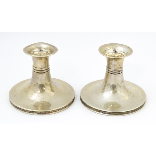 456 - Scandinavian silver: A pair of Danish silver candlesticks with banded detail, bearing assayers marks... 