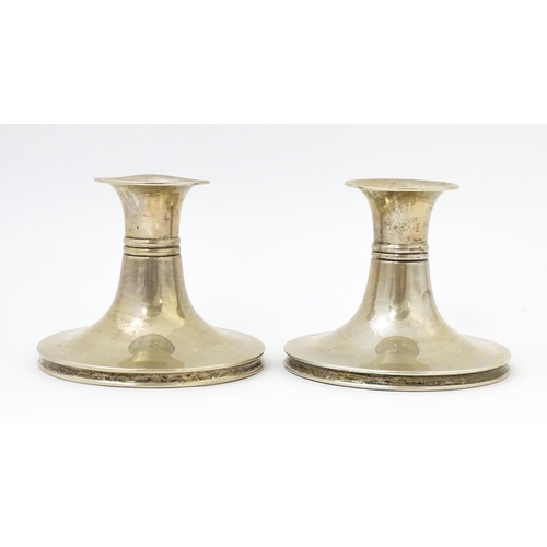 456 - Scandinavian silver: A pair of Danish silver candlesticks with banded detail, bearing assayers marks... 