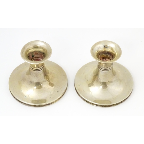 456 - Scandinavian silver: A pair of Danish silver candlesticks with banded detail, bearing assayers marks... 