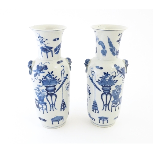 1 - A pair of Chinese blue and white vases with cast lion mask and ring handles, decorated with various ... 