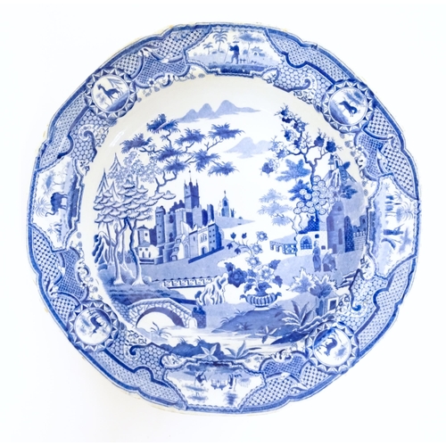 100 - A Spode blue and white plate in the Gothic Castle pattern. Impressed mark under. Approx. 9 1/2