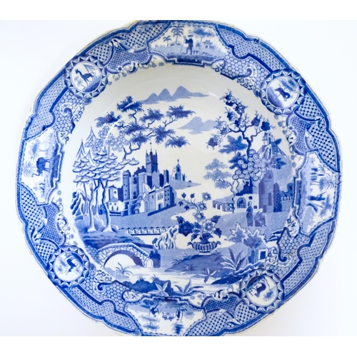 100 - A Spode blue and white plate in the Gothic Castle pattern. Impressed mark under. Approx. 9 1/2