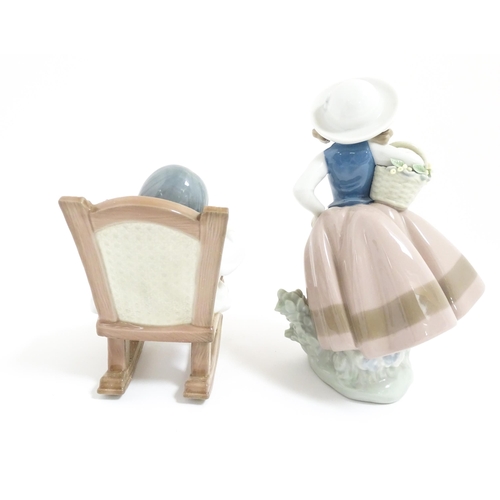 119 - Two Lladro figural group comprising Naptime no. 5448, and Sweet Scent no. 5221. With boxes. Largest ... 