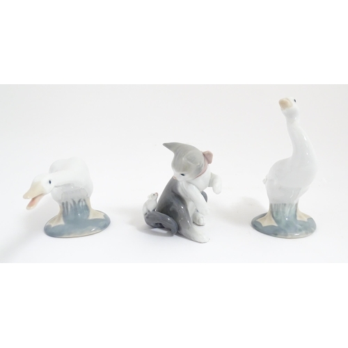 120 - Three Lladro animals comprising Cat with Mouse, Honking Goose and Duck. With boxes. Goose approx. 6