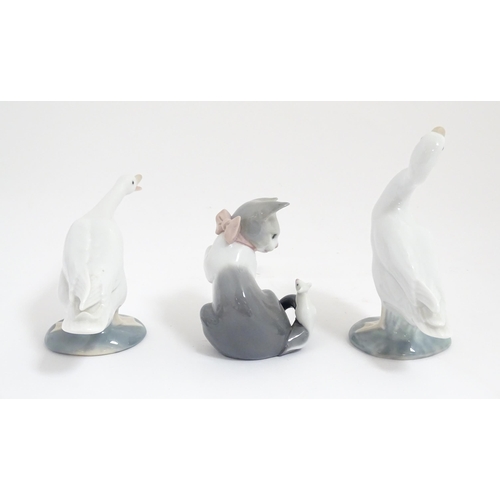 120 - Three Lladro animals comprising Cat with Mouse, Honking Goose and Duck. With boxes. Goose approx. 6