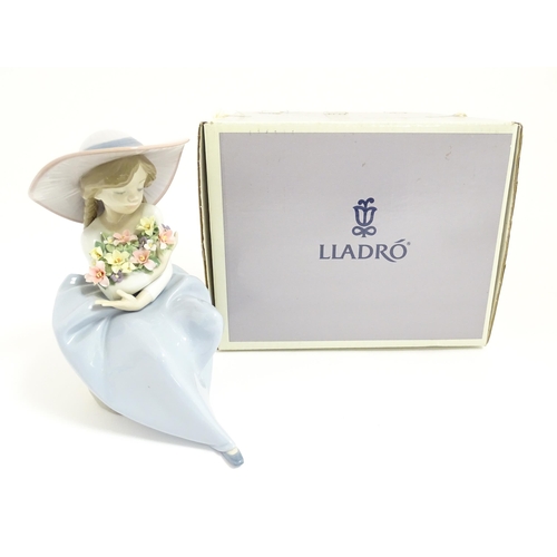 122 - A Lladro figure Fragrant Bouquet, no. 5862. With box. Approx. 8 1/4
