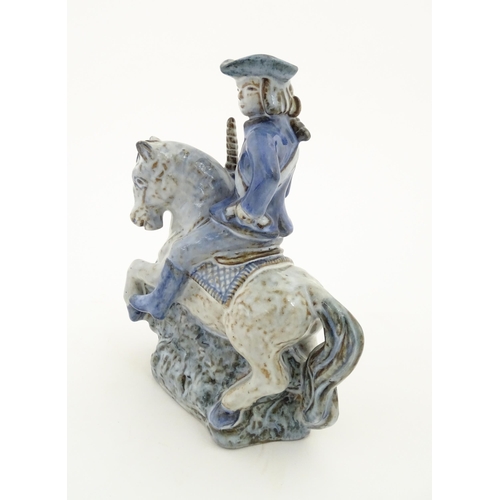 130 - A Danish pottery model of a figure on horseback by L. Hjorth. Marked under L. Hjorth Denmark. Approx... 